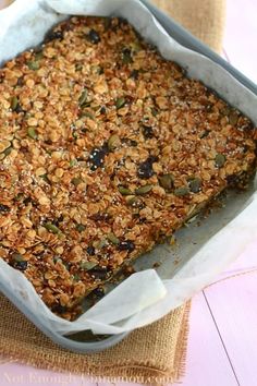 a pan filled with granola sitting on top of a table