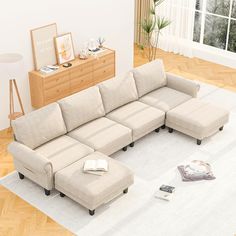 a large sectional couch sitting on top of a white rug