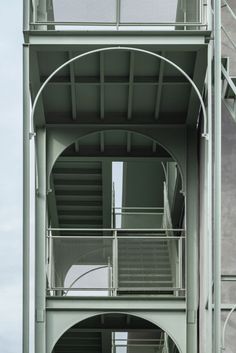 an image of a building with stairs going up to the upper floor and second story