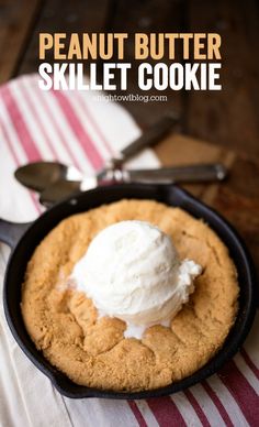 peanut butter skillet cookie in a cast iron skillet with ice cream on top