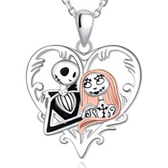 two hearts shaped necklace with skeleton and girl in the middle, one is holding a heart