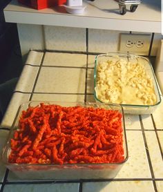 two dishes of food sitting on the counter next to each other