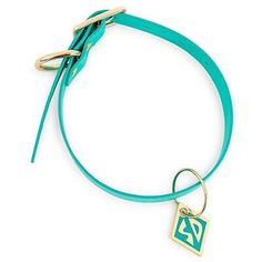 a turquoise leather bracelet with a gold charm on the end and a small square tag attached to it