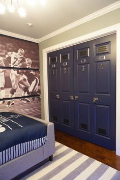 a bedroom with a bed and lockers on the wall next to a large painting