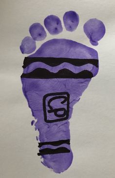 a child's hand and foot print made out of purple crepe paper