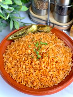 a bowl filled with rice on top of a table