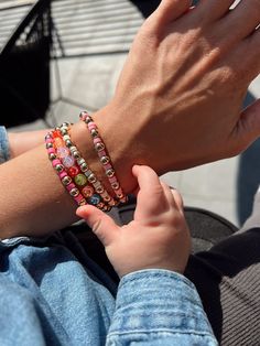 One of Helena's favorites! The Smile Beaded bracelet is a fun piece to add some variety and color to any stack! Wear your smile on your sleeve, and draw some more attention to your GH stack with these fun colors! Material: 18K Gold Filled Bead Size: 6mm Length: 6' inches (Stretches to 6.5') Chain Type: Beaded Trendy Beaded Bracelets For Birthdays, Trendy Beaded Bracelet For Birthday, Adjustable Stackable Beaded Bracelets For Birthday, Trendy Round Bead Bracelets For Birthday, Trendy Stackable Bracelets For Birthday, Trendy Beaded Bracelets For Birthday, Trendy Round Beaded Bracelets For Birthday, Colorful Beaded Bangle Bracelets For Friendship, Pink Stackable Heishi Beads Bracelets