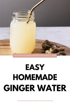 homemade ginger water in a mason jar on a cutting board with cinnamons and cloves