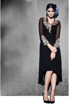 This stylish and glamorous designer georgette kurti in a black shade has a beautiful floral embroidered pattern on the neckline all the way to the back. To make it even more pretty, the dress has an uneven hem and matching embroidered cuffs. Pair this gorgeous indo-western kurti with flats for a casual feel or pumps for a classy, refined look. Available as stitched (ready-to-wear). Note: There might be a slight color variation due to lighting and flash used during photoshoot. The bright shade se Black Kurti, Georgette Tunics, Lehenga Style Saree, Stylish Kurtis, Buy Designer Sarees Online, Tunic Designs, Salwar Kamiz, Designer Sarees Online, Blue Embroidery