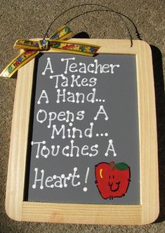 a chalkboard with writing on it that says teacher take hand opens a mind touches a heart