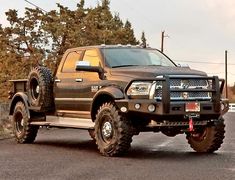 a large brown truck parked in a parking lot