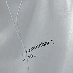 a white shirt with an earphone attached to the side that says, remember? no