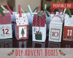 small christmas gift bags are lined up on a table