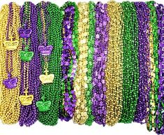 many different colored beads and necklaces on display