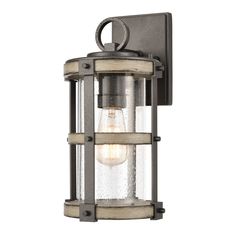 an outdoor wall light with a clear glass shade on the top and bottom part of it