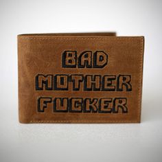 a leather wallet with the words bad mother fuckinger on it