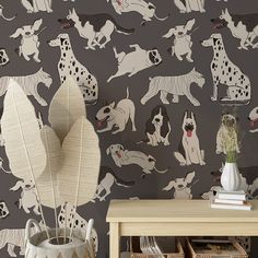 the wallpaper has dogs on it and is grey with black spots, which are all over