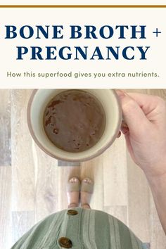 a person holding a coffee cup in their hands with the caption bone broth + pregancy how this superfood gives you extra nutrities