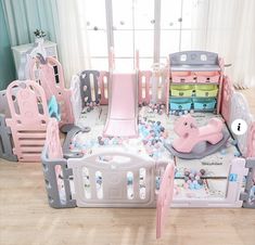 a child's playpen with lots of toys in it