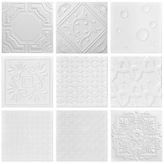 several white tiles with different designs on them