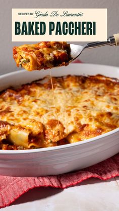 a close up of a casserole with cheese being drizzled over it