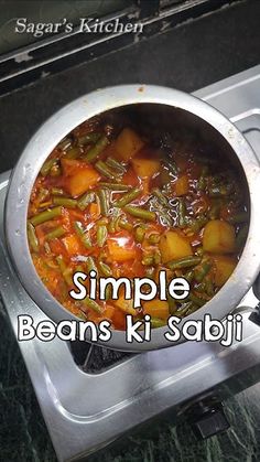 a pot filled with stew sitting on top of a stove