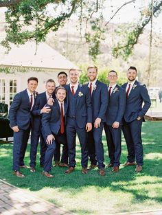 a group of men in suits standing next to each other