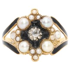 An antique yellow gold, pearl, black enamel and diamond ring, comprising of one sparkling old mine cut diamond set in centre of a black enamelled panel, four larger pearls, two smaller pearls and 10 tiny pearls, set in 18 karat yellow gold, on a band of 18 karat yellow gold. The central sparkling diamond is set in a field of black enamel, which is in excellent condition. Four lustrous pearls are set to each of the four corners and a trio of smaller pearls are set North, South, East and West, between the larger pearls. The shoulders of the ring are elegantly split and are complete with black enamel. The back of the band is elegantly reeded and wonderfully crisp Victorian hallmarks are displayed on the inside of the band, with another to the outside. Verso, there would have originally been a Hair Locks, Sparkle Diamonds, Black Enamel, Cocktail Rings, Locket, Antique Jewelry, Gold Diamond, Diamond Ring, Diamond Cuts