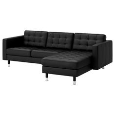 a black leather sectional sofa with gold legs