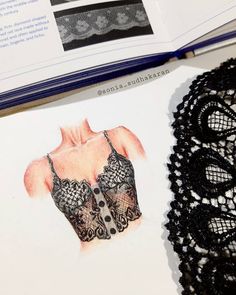 an open book with pictures of bras and lace on the pages next to it