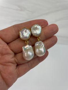 Gorgoeus baroque pearl earrings!  The actual pair on the listing has been sold. This is custom ordered.  This handmade Baroque Pearl earrings is classic and elegant.  The Baroque or flameball cultured freshwater dangling pearls are large 14mm to 15mm x 20mm to 21mm,  white, lustrous, AAA quality, attached to a gold filled bail/peg.  The ear finding is a beautiful 22k gold plated freshwater baroque Pearl, bezeled, brass body. Comes with large ear nuts.    Just simply gorgeous, great for weddings, Baroque Pearl White Earrings With Pearl Charm, Baroque Pearl White Pearl Earrings For Anniversary, Formal Baroque Pearl Chain Earrings, Pearl White Baroque Pearl Earrings For Wedding, Wedding Pearl Earrings With Baroque Pearl Chain, Baroque Pearl Wedding Earrings In Pearl White, Baroque Pearl Chain Earrings For Wedding, Pearl White Baroque Pearl Drop Bridal Earrings, Pearl White Bridal Earrings With Baroque Pearl Drop