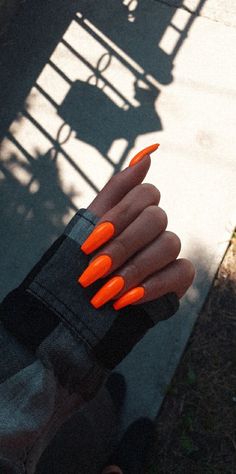 Neon Orange Nails Coffin, Highlighter Orange Nails, Long Neon Orange Acrylic Nails, Black And Neon Orange Nails, Bright Orange Nail Ideas, Neon Fall Nails, Orange Nails Coffin, Neon Orange Nails With Design, Long Orange Nails