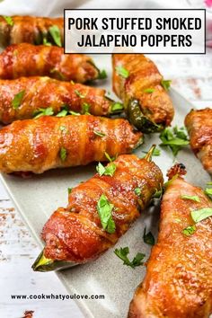 pork stuffed smoked jalapeno poppers on a platter with text overlay