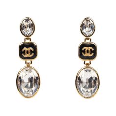 These 21G Chanel crystal earrings are in a drop earrings design, with the classic "Chanel CC" letter logo with black enamel and gold tone hardware. Origin: FranceCondition: New and never wornAccompanied by: Chanel box, ribbon, carebookMeasurements: 2.5" drop Luxury Crystal Dangle Earrings, Luxury Crystal Earrings For Evening, Cc Letter, Classic Chanel, Box Ribbon, Chanel Box, Dangle Earrings Gold, Earrings Design, Crystal Dangle Earrings