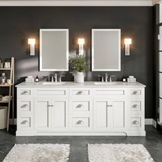 a bathroom with double sinks and two mirrors