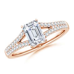 an emerald cut engagement ring with diamonds on the band and side stones in 18k rose gold