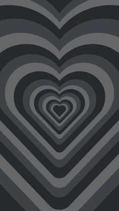 an image of a heart made out of black and grey shapes on a dark background