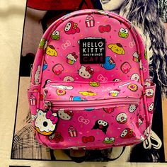 Hello Kitty Cafe Mini Pink Backpack. Sanrio And Friends Hello Kitty Cafe Special Edition Backpack. Pink Pleather With A Black Backing And Straps. Many Of Sanrio Characters. Keroppi Kuromi My Melody Pompompurin Tuxedo Sam Cinnamoroll Donuts Cupcakes And More! Super Cute! Nwt From Claire's. Sanrio And Friends, Hello Kitty Lunch Bag, Dream Accessories, Tuxedo Sam, Glitter Backpack, Kitty Cafe, Sequin Backpack, Kuromi My Melody, Uniqlo Bags