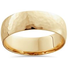 a gold wedding ring with hammered finish on the outside and an interior band in yellow gold