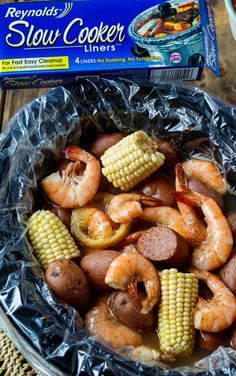 shrimp and corn on the cob with slow cooker dinner mix in a bowl