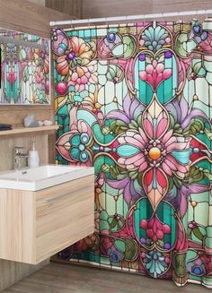 a bathroom with stained glass shower curtain and sink