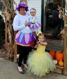 a woman and child dressed up in costumes