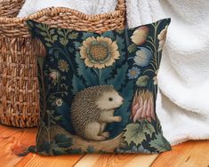 "Welcome the allure of forest life to your outdoor area with our Outdoor Hedgehog Pillow. Boasting a charming hedgehog motif, this cushion brings a touch of woodland magic to your patio, porch, or garden setting. Highlighting the endearing charm of hedgehogs, this pillow enhances your outdoor spaces with its whimsical character. Constructed with high-quality materials that are resistant to water, mildew, and UV rays, this pillow ensures enduring vibrance and quality. Whether as a unique gift for Hedgehog Pillow, Eclectic Townhouse, Forest Life, Woodland Decor, Cottagecore Decor, Floral Cushions, Outdoor Pillow, Hedgehogs, Patio Porch