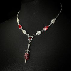 Betrayed necklace (Limited edition) Sinister themed necklace with hanging skull and blood drop design on a stainless steel chain. Handmade to order; ready in 3-4 days. May take longer during busy times. Gothic Halloween Necklace With Lobster Clasp, Gothic Stainless Steel Pendant Necklace, Gothic Clavicle Chain Necklace For Halloween, Gothic Stainless Steel Clavicle Chain Necklace, Gothic Chain Jewelry For Valentine's Day, Gothic Stainless Steel Necklace With Adjustable Chain, Punk Red Necklace For Halloween, Gothic Halloween Clavicle Chain Necklace, Gothic Valentine's Day Chain Jewelry