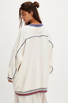 Too-cool and comfy, this crew from our We The Free collection features a slouchy, oversized fit and soft cotton fabrication with contrast trim and ribbed hems. **Fit:** Slouchy, oversized fit **Features:** Soft cotton fabrication, classic crew-neckline, contrast seam detailing, drop-shoulder sleeves with elasticated cuffs, ribbed hems **Why We ❤ It:** This pullover is perfect for throwing on before heading out. | We The Free Varsity Crew at Free People in White, Size: S Collegiate Oversized Sweats With Ribbed Cuffs, Oversized Varsity Sweats With Ribbed Cuffs, Oversized Varsity Fleece Tops, Oversized Varsity Long Sleeve Sweatshirt, Free People Striped Sweatshirt, Contrast Trim, Hoodie Top, Shoulder Sleeve, Oversized Fits