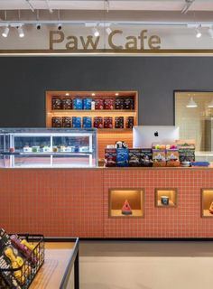 the inside of a restaurant with food on display