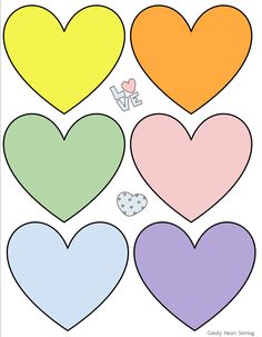 four hearts cut out to make the shape of a heart with different colors and shapes