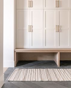 a large white cabinet with drawers in a room