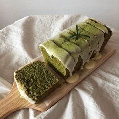 a piece of cake sitting on top of a wooden cutting board