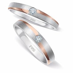 two white and rose gold wedding rings with diamonds on each side, set against a white background